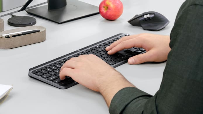 Man Working with MX Keys for Business